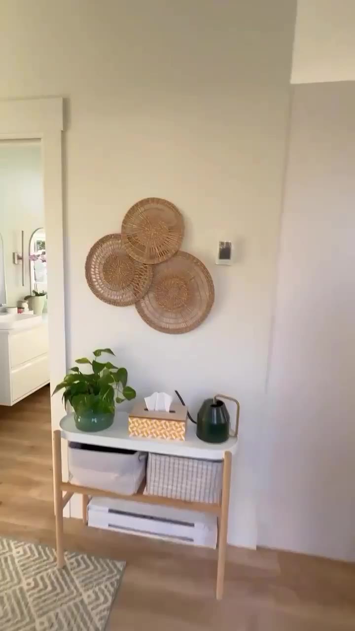 The kitchen of a finished home, dark green lower cabinets and a herringbone backsplash